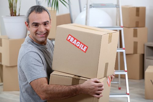 Local business relocation with labelled boxes and packed office items