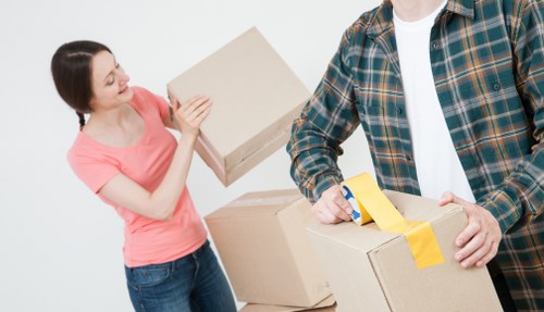 Careful loading of furniture and boxes into a moving van in Cranford