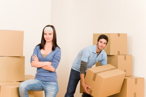 Careful loading of household items into a removal van
