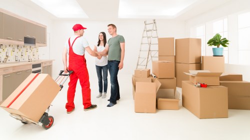 Removal team handling furniture and boxes for a Cranford home move